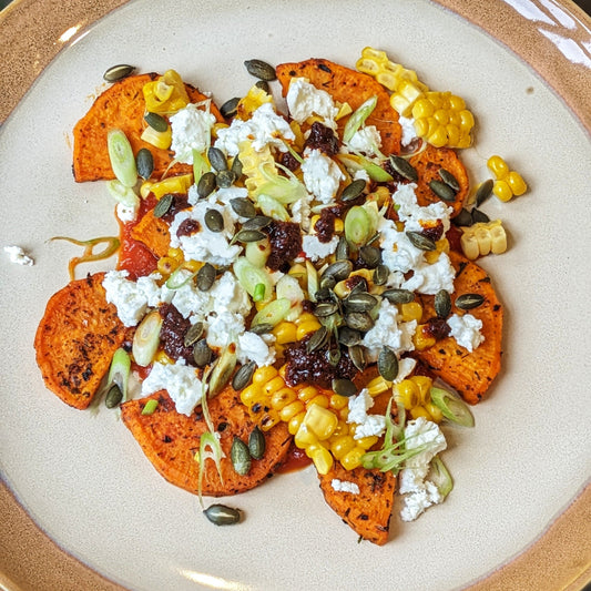 Spicy Sweet Potato with Corn, Feta and Harissa Drizzle