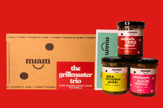 Miam food products including jars and a box on a red background